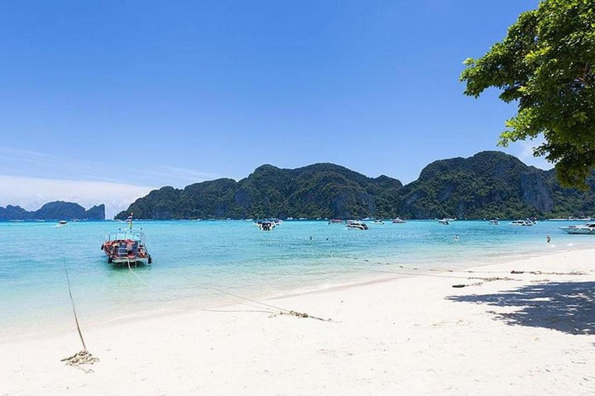 a boat in the water on a beach