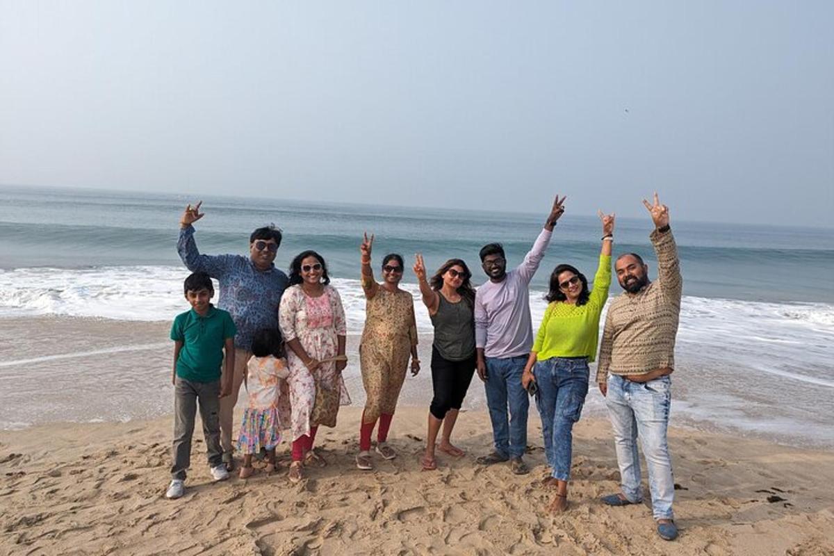 a group of people standing on the beach