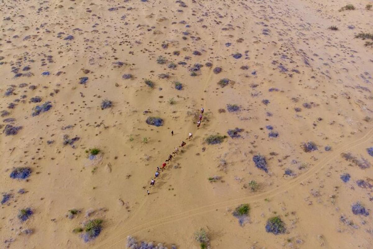 an aerial view of a road in a desert