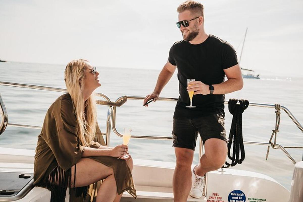 a man and a woman standing on a boat