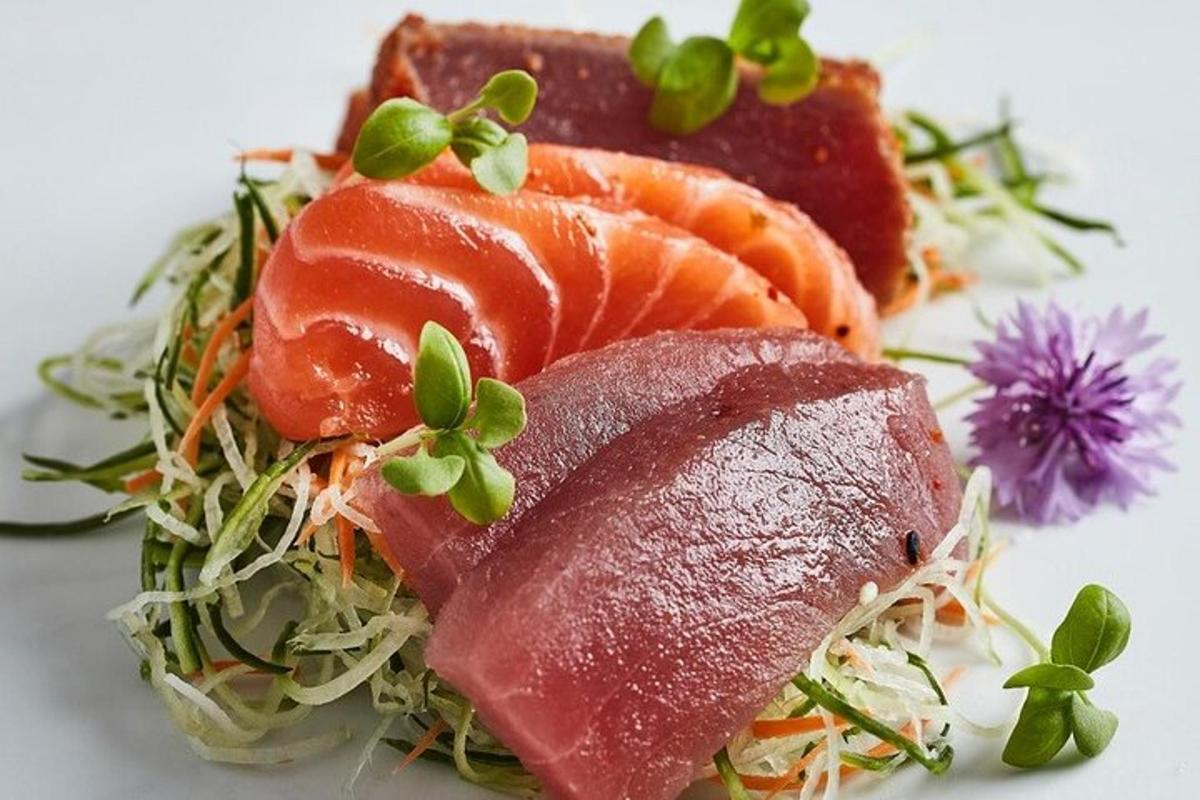 a plate of food with salmon and other foods