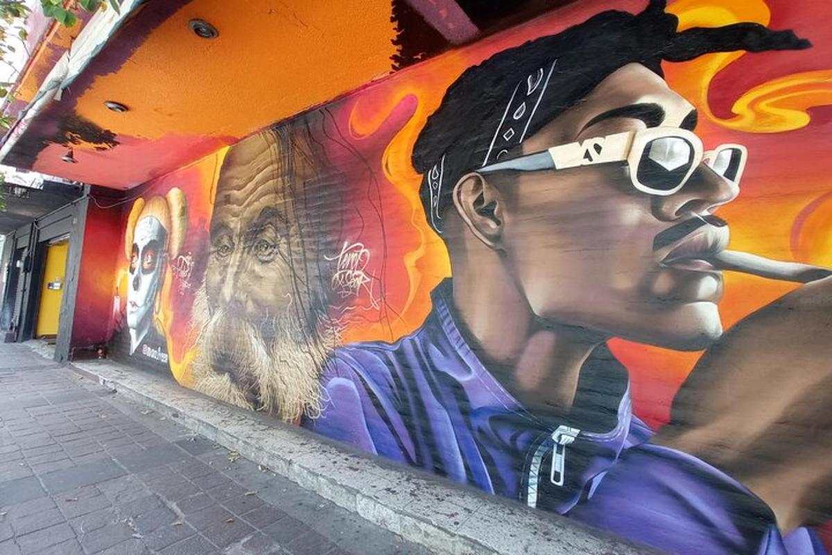 a mural of a man smoking a cigarette