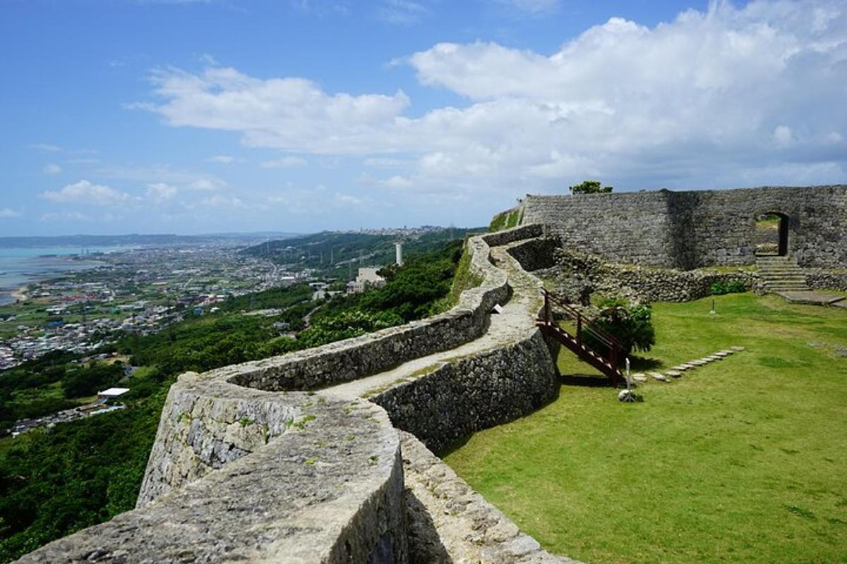 a stone wall with a view of a city