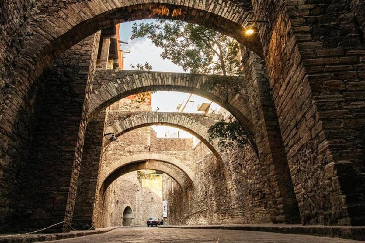 an old stone bridge with three arches on it