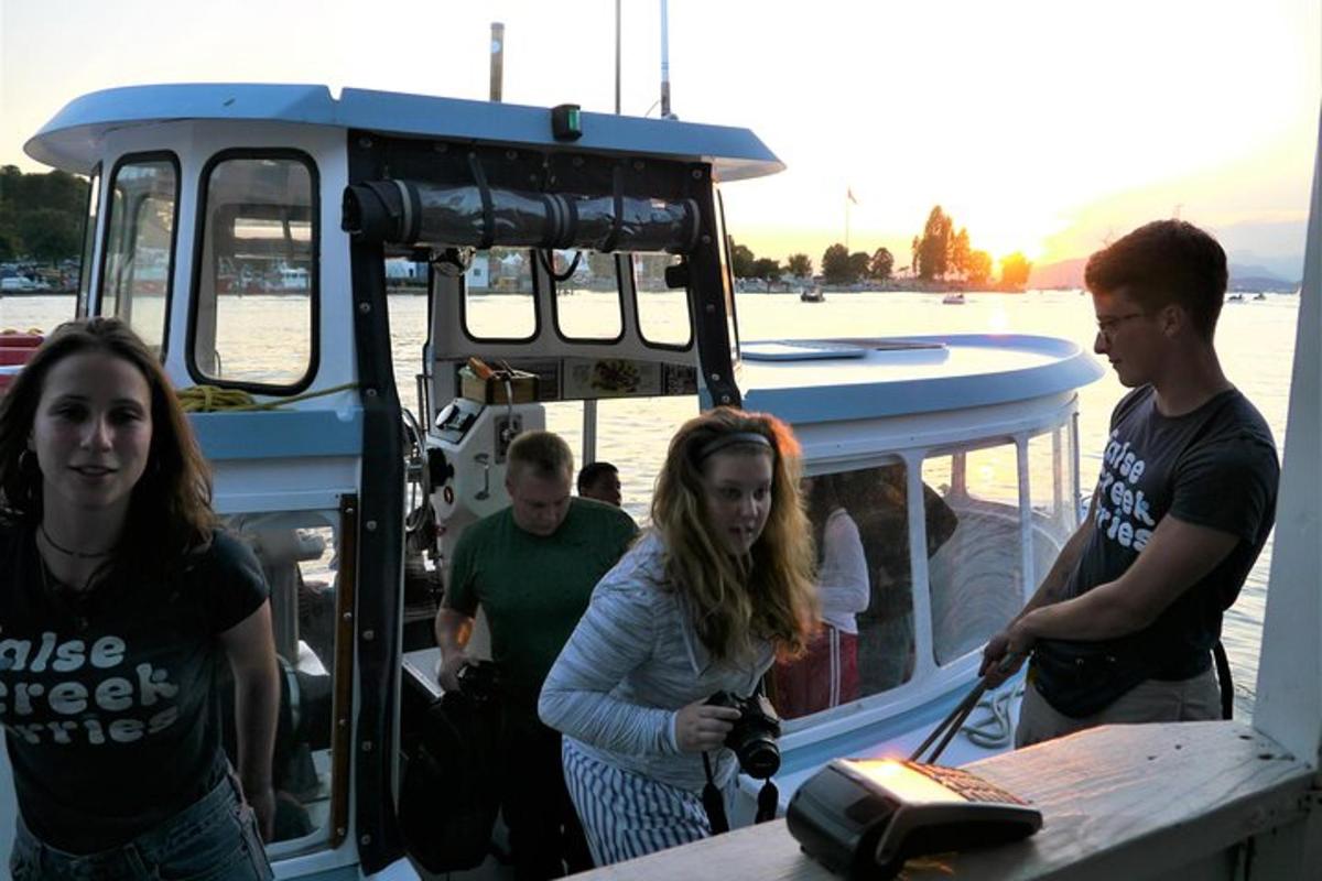 a group of people standing on a boat