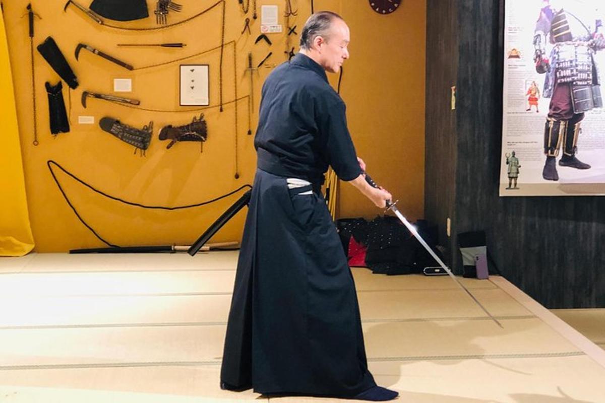 a man with a cane in front of a museum