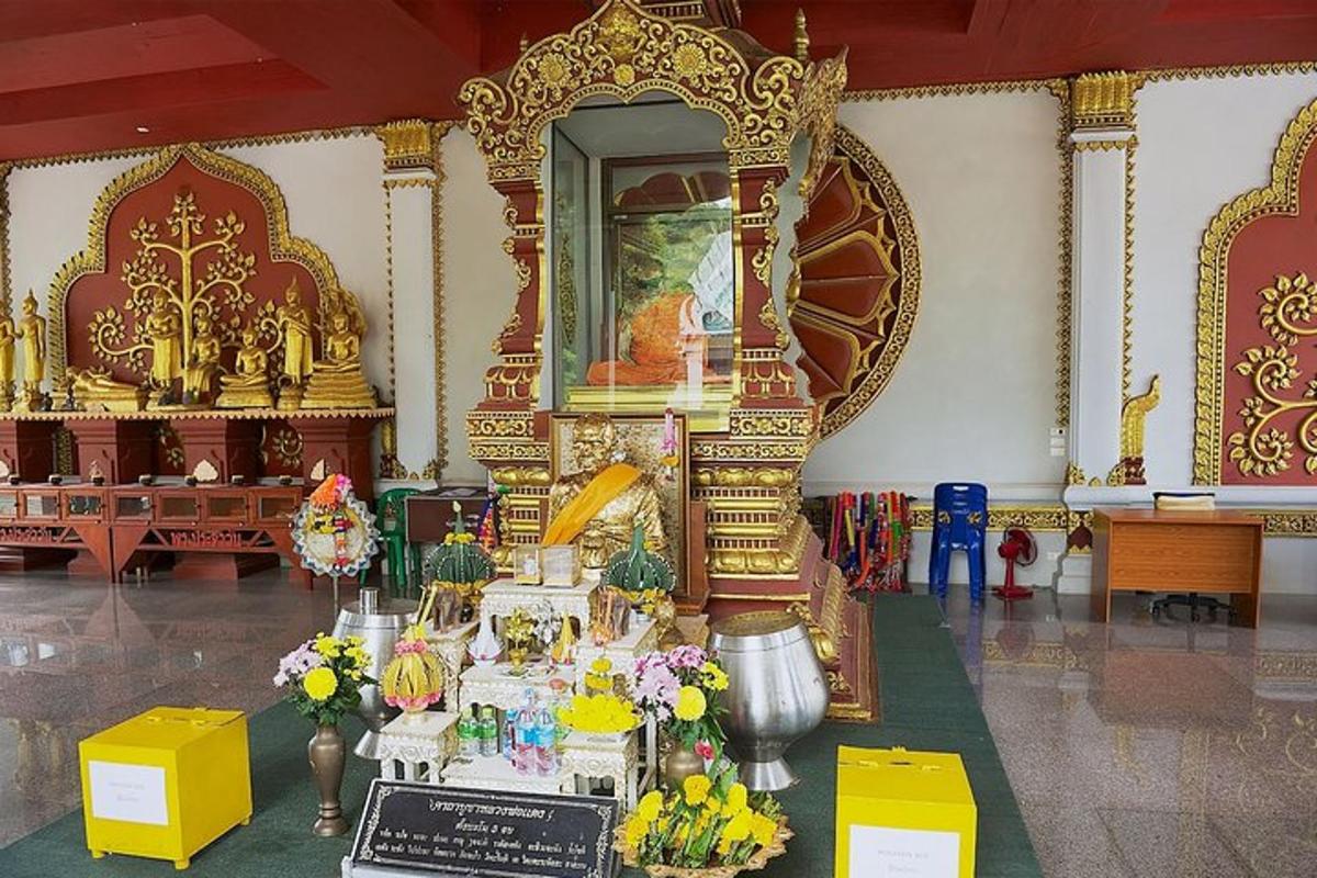 a room with a altar with flowers and other items
