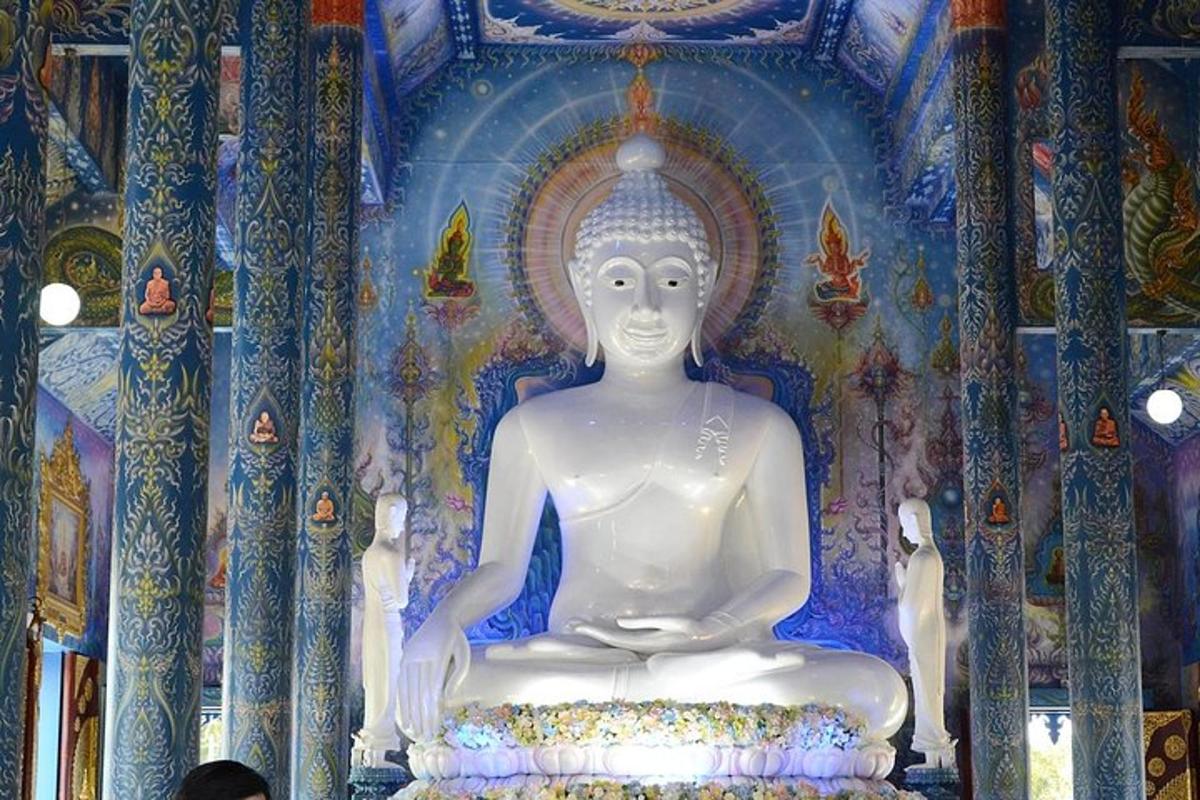 a large white statue sitting in a room