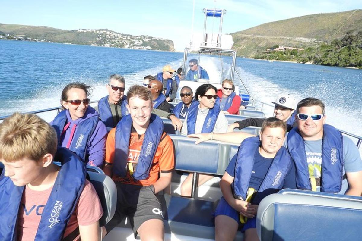 a group of people on a boat in the water