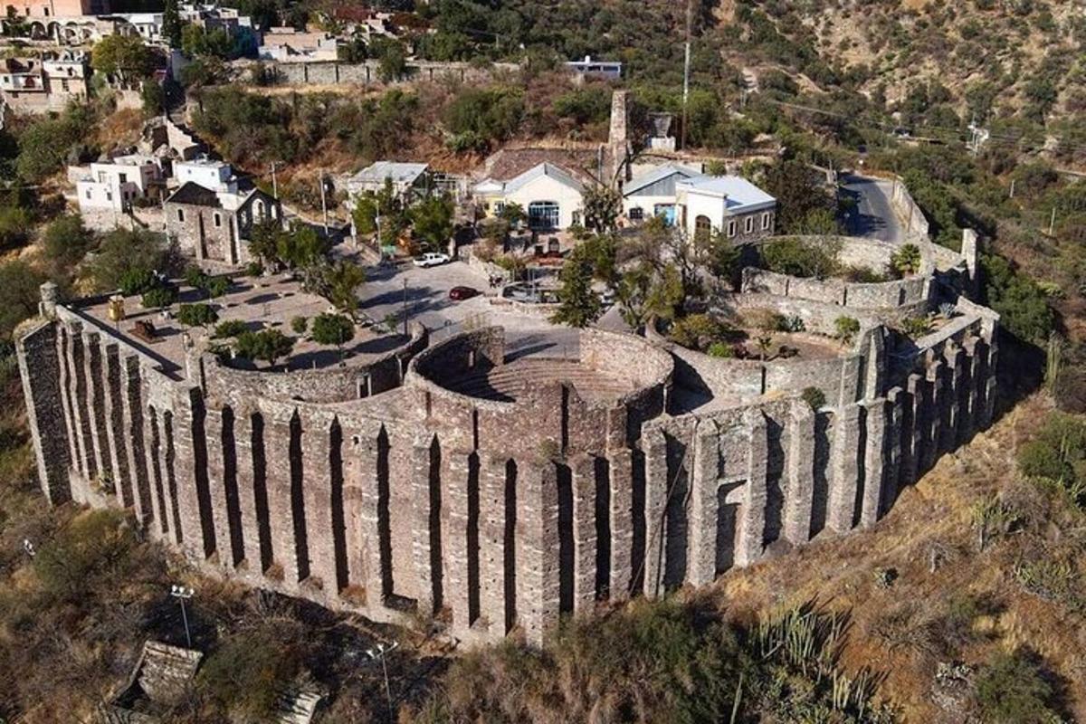 an aerial view of a castle on a hill