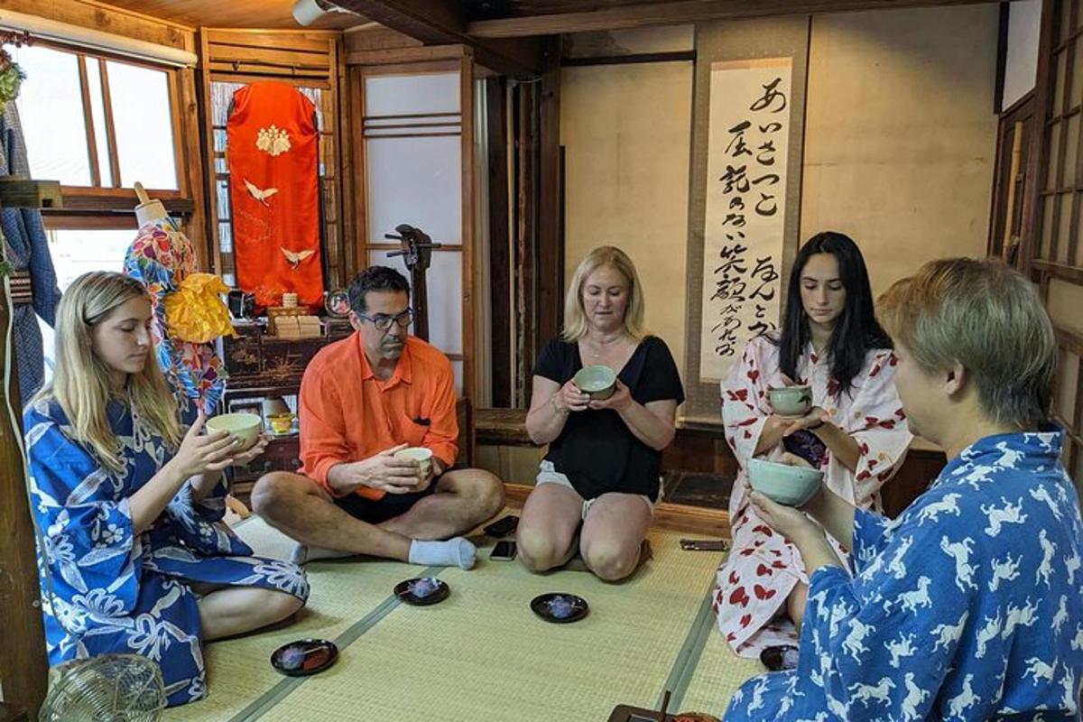 a group of people sitting on the floor eating food