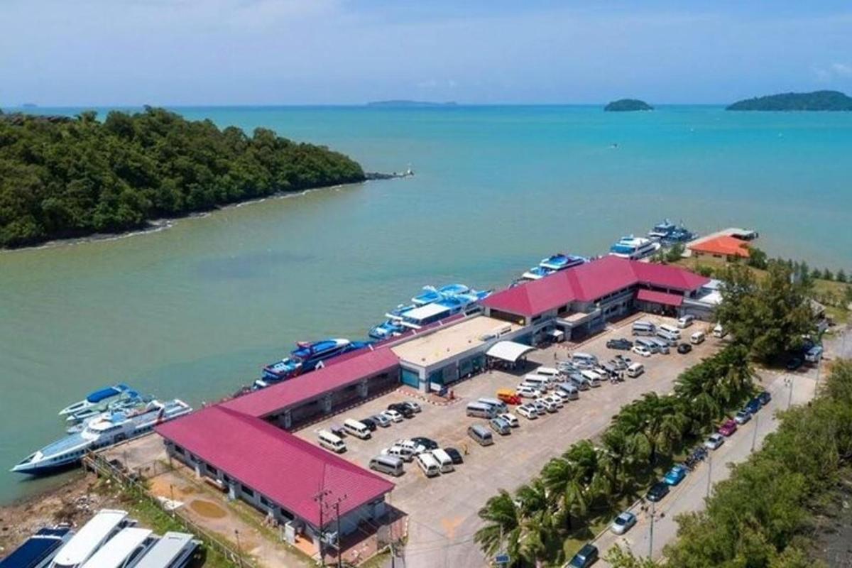 an aerial view of a marina with cars parked
