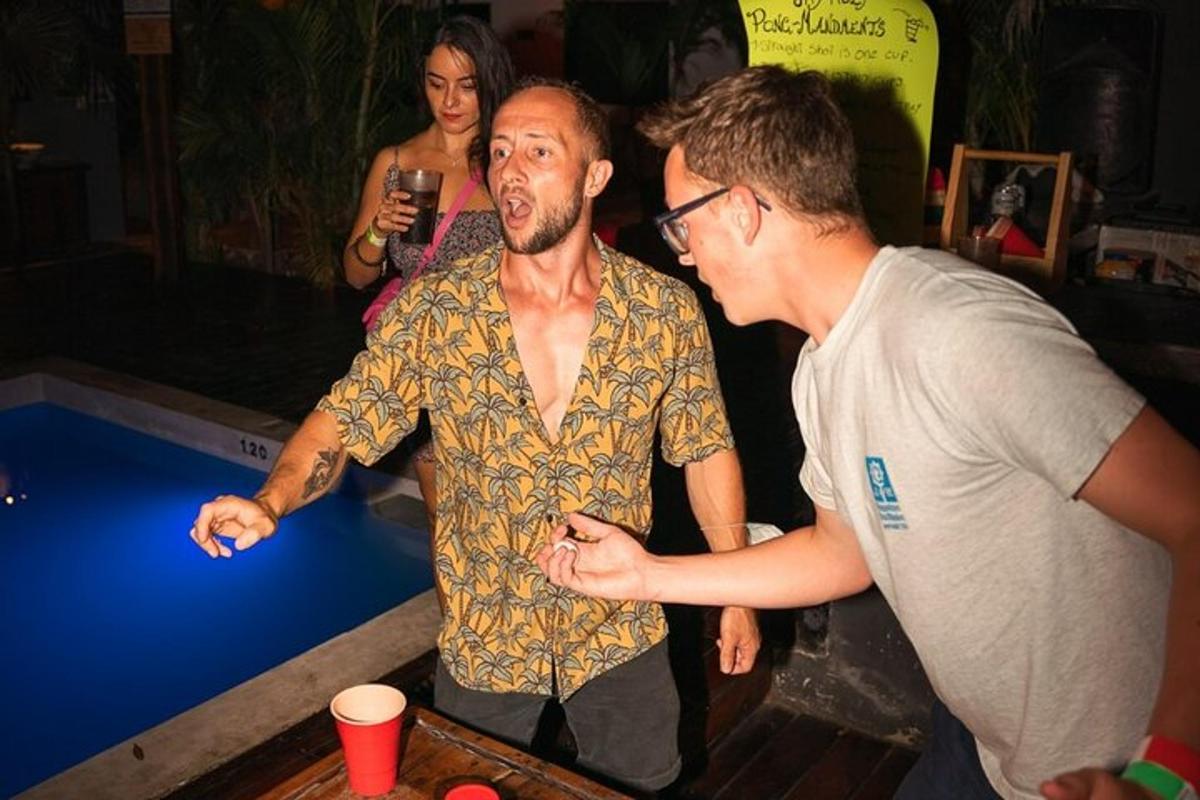 two men standing next to a table in a casino