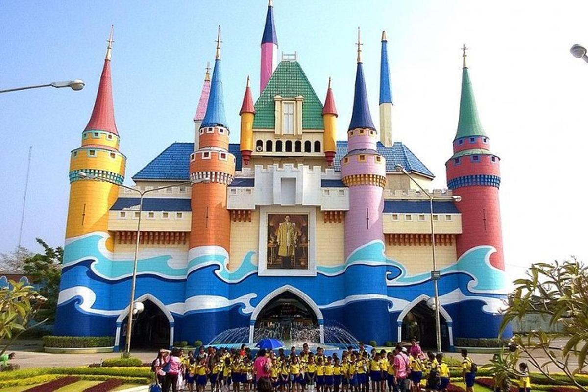 a group of people standing in front of a castle