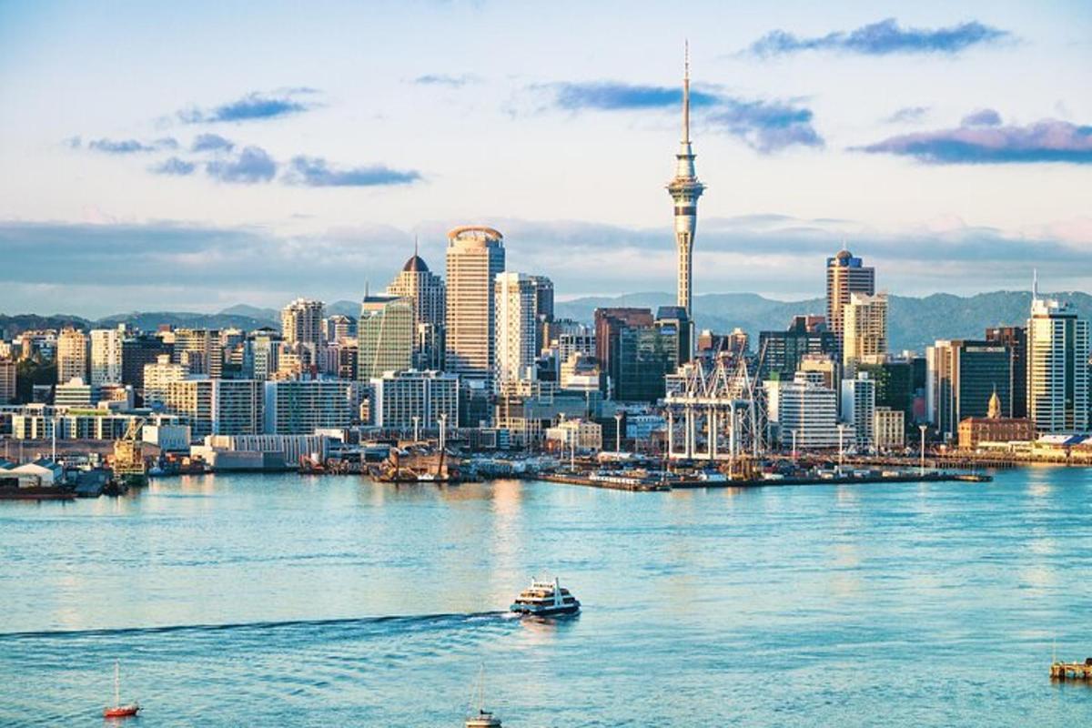 a view of auckland city with a boat in the water