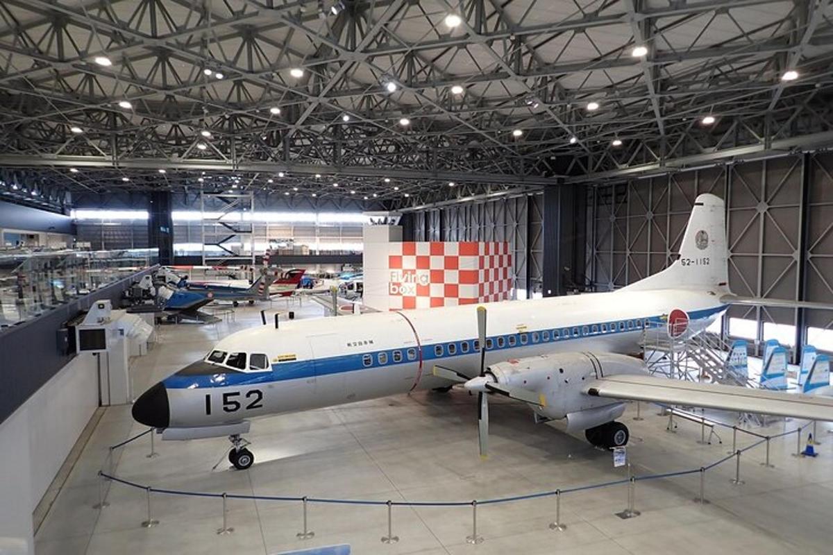 a small plane is on display in a hangar
