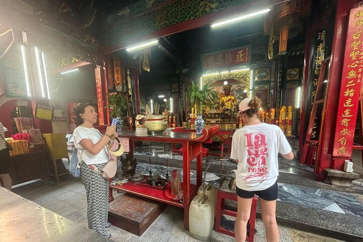 a man and a woman standing in front of a store