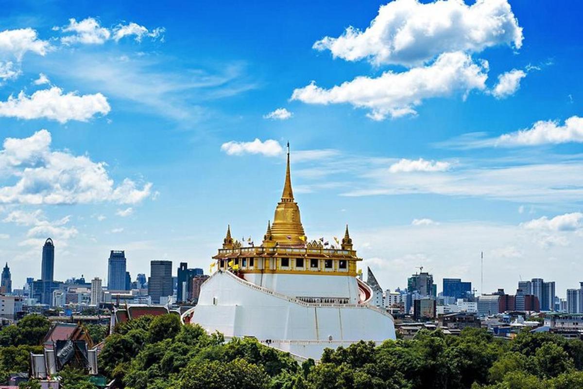 a building with a gold top on top of a city
