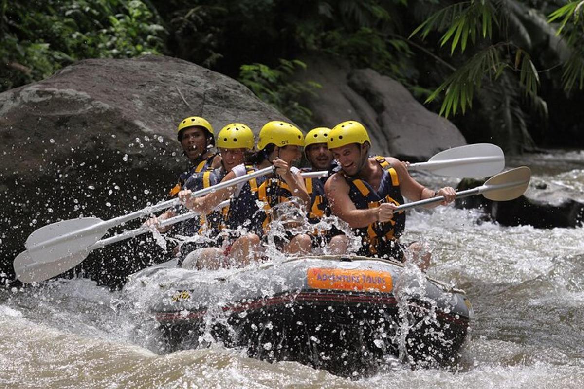 a group of people in a raft in the water