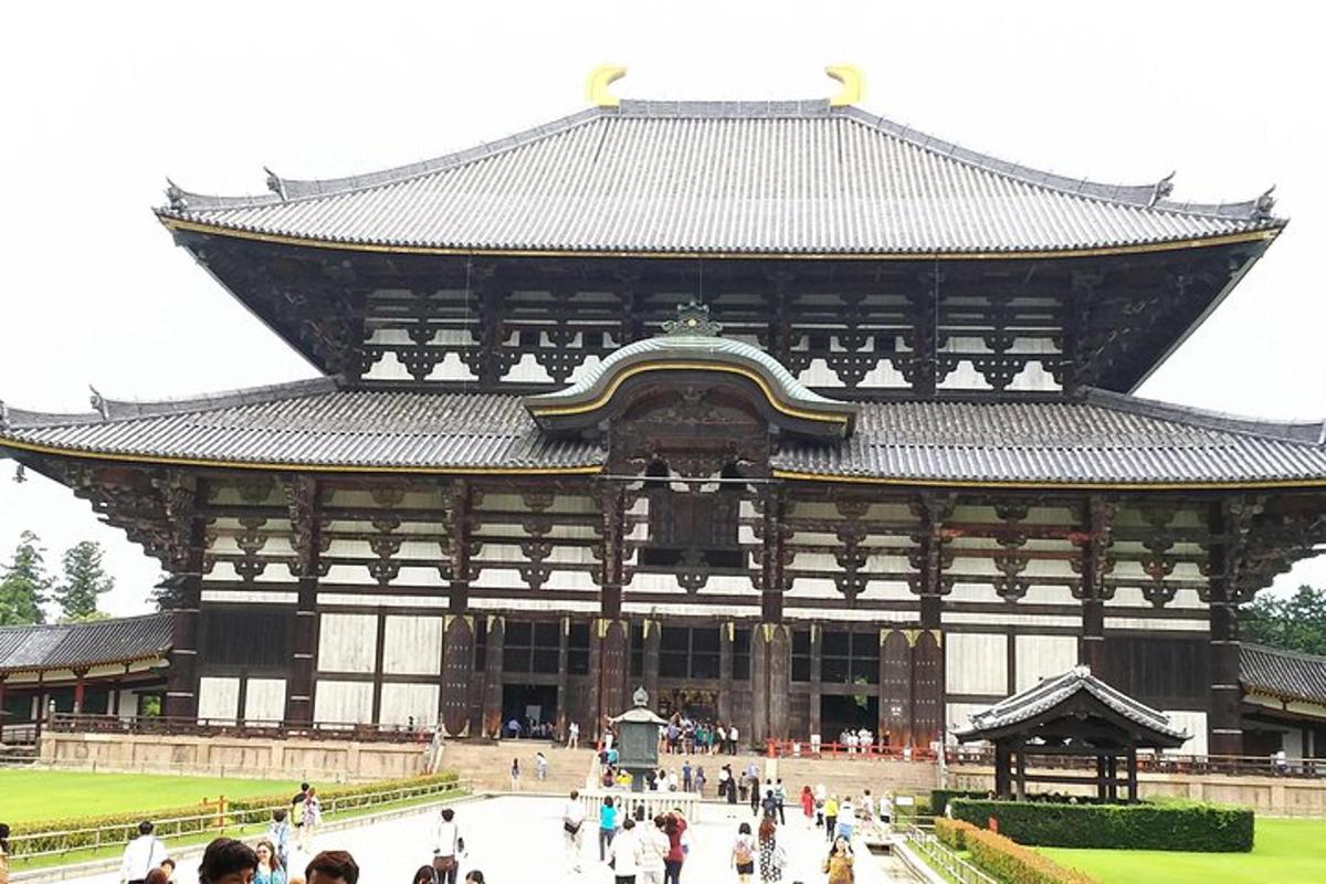 a large building with people walking in front of it
