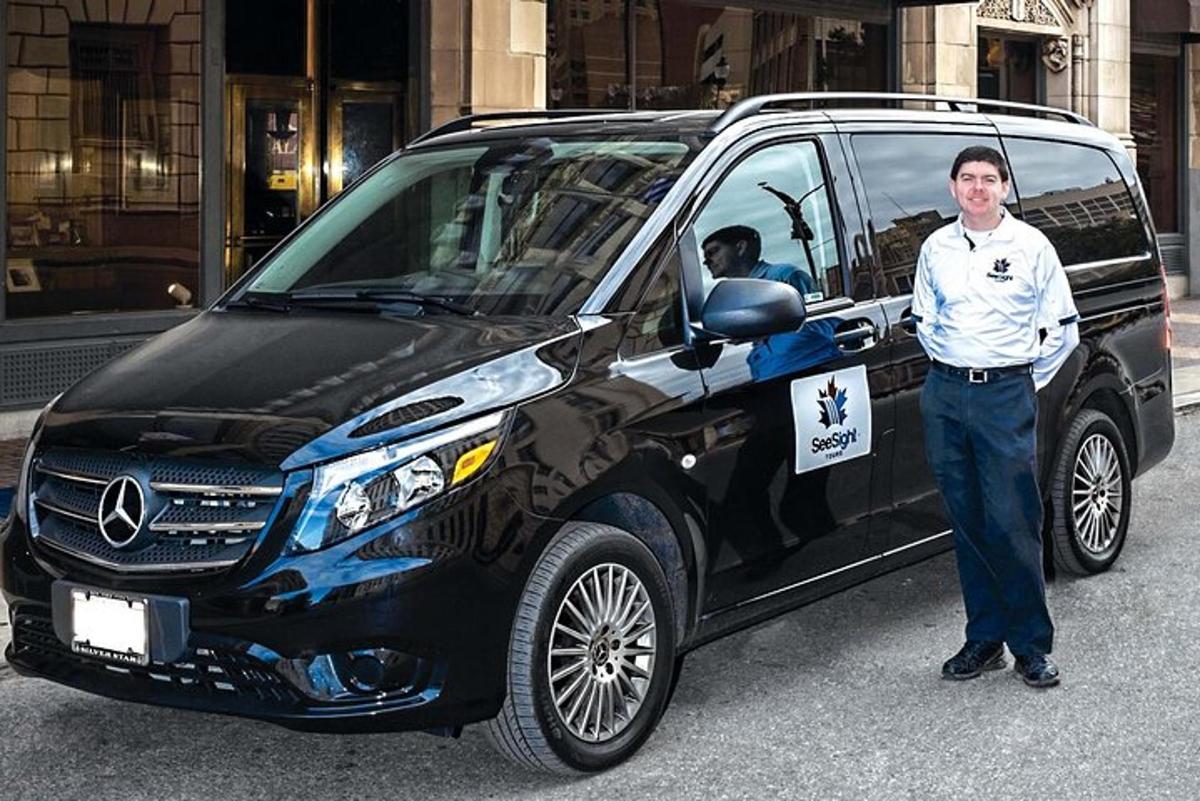 a man is standing in front of a van