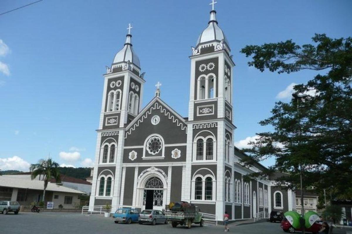 a large church with cars parked in front of it