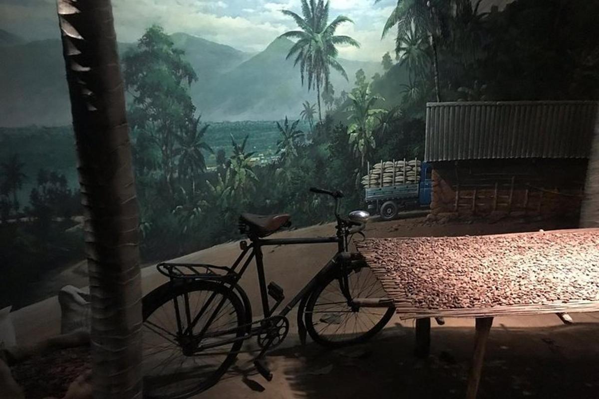 a bike parked next to a table in front of a mural