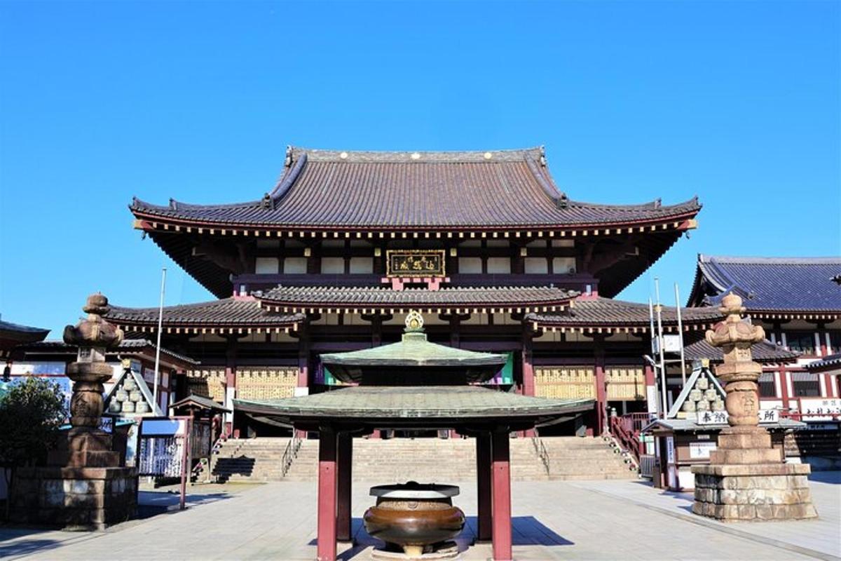 a large building with a fountain in front of it