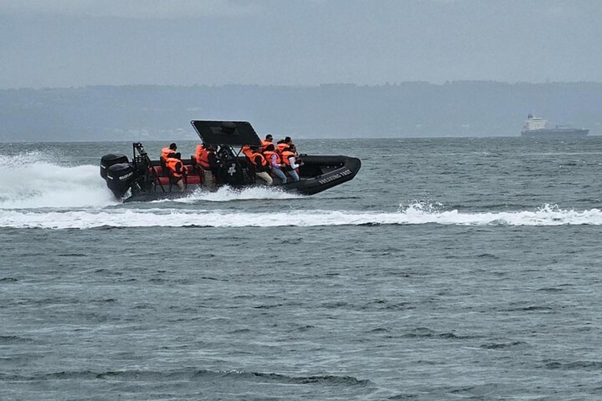 a group of people on a boat in the water