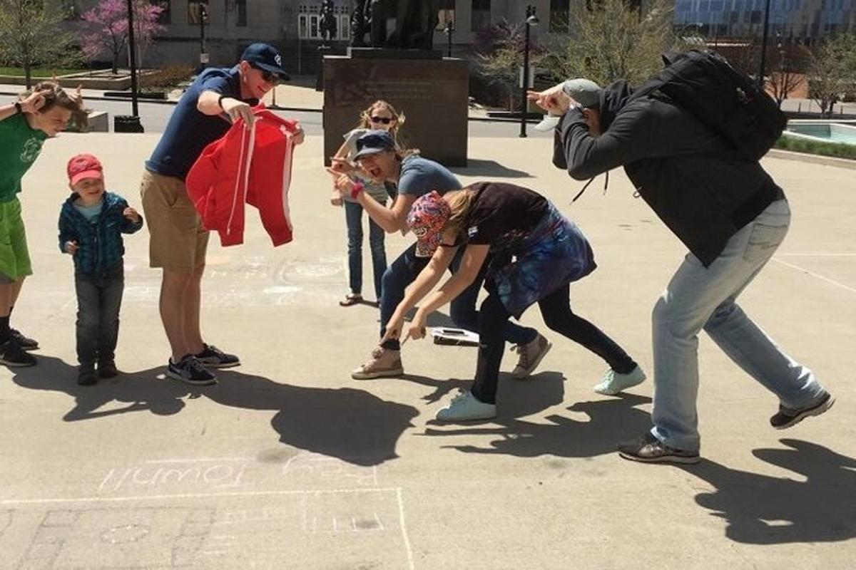 a group of people standing around in a park