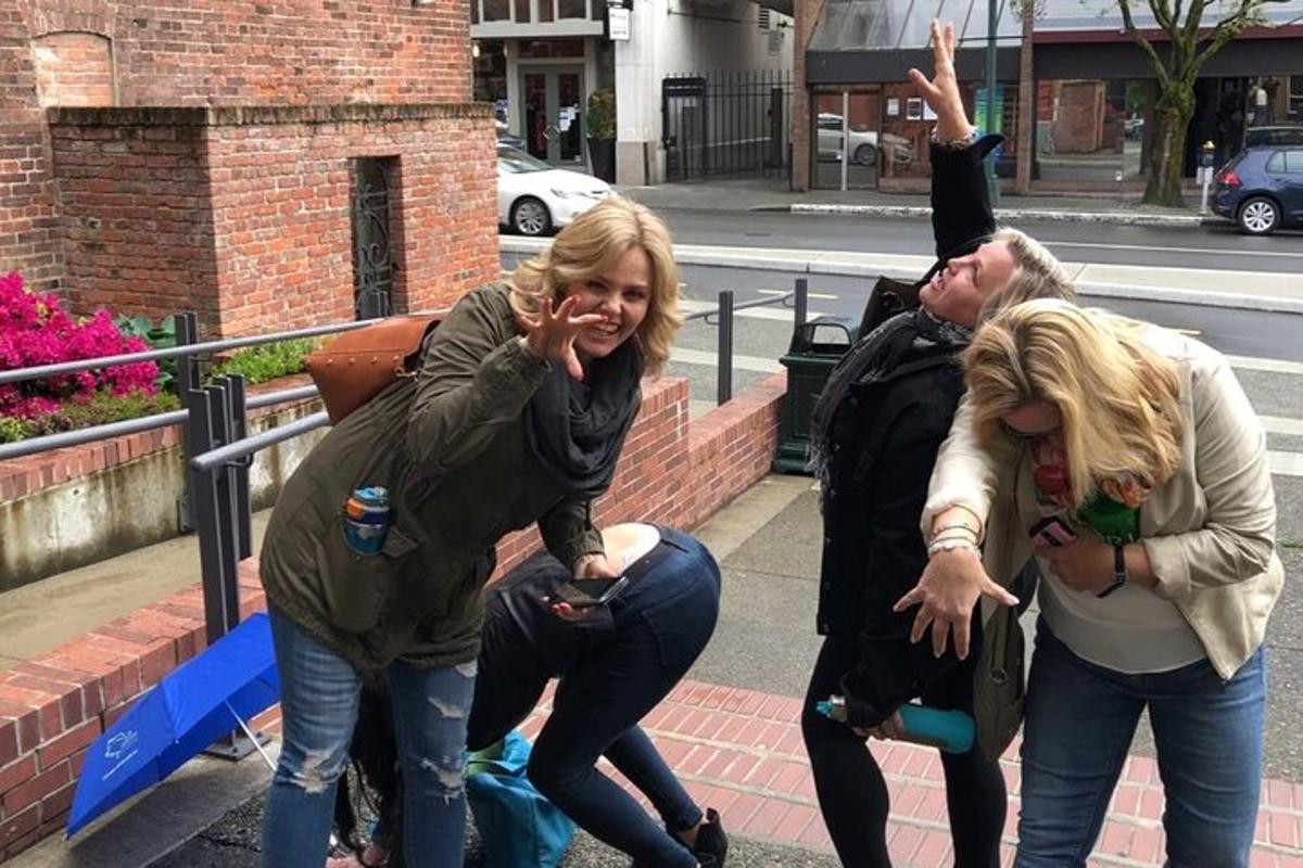 a group of people standing on a sidewalk