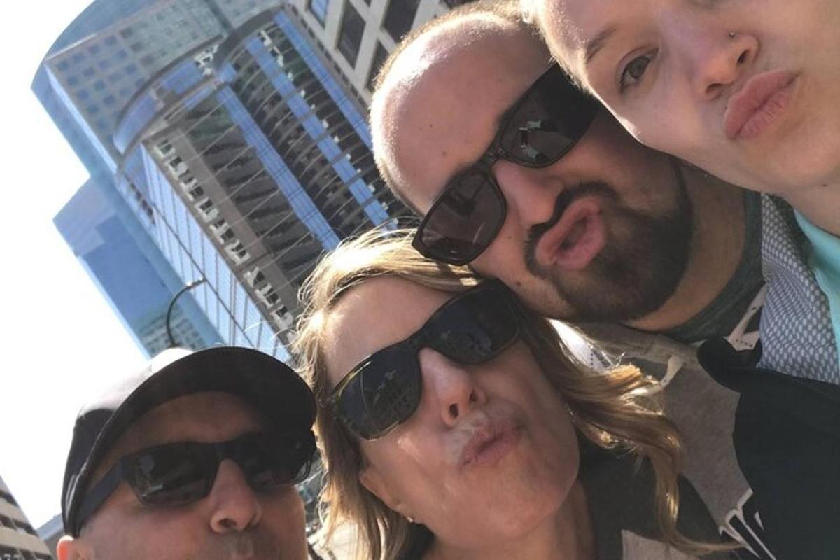 a group of people wearing sunglasses posing for a picture