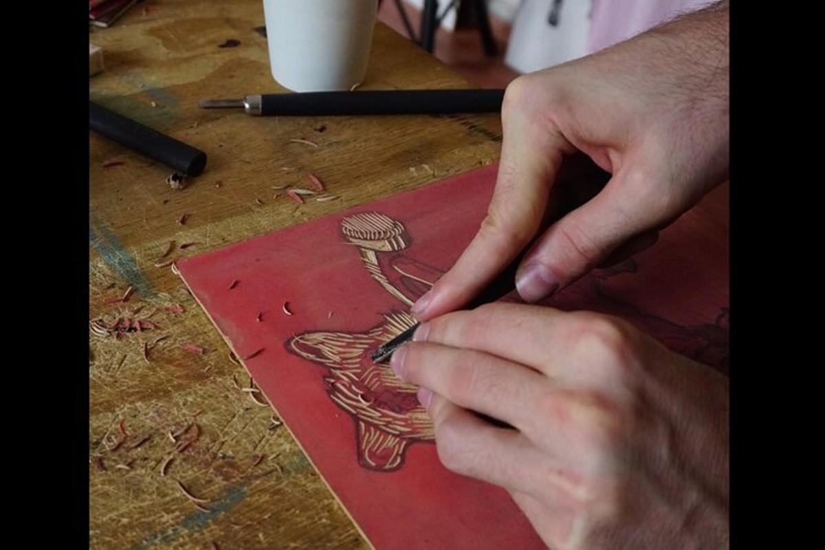a person cutting a picture of a bird on a table