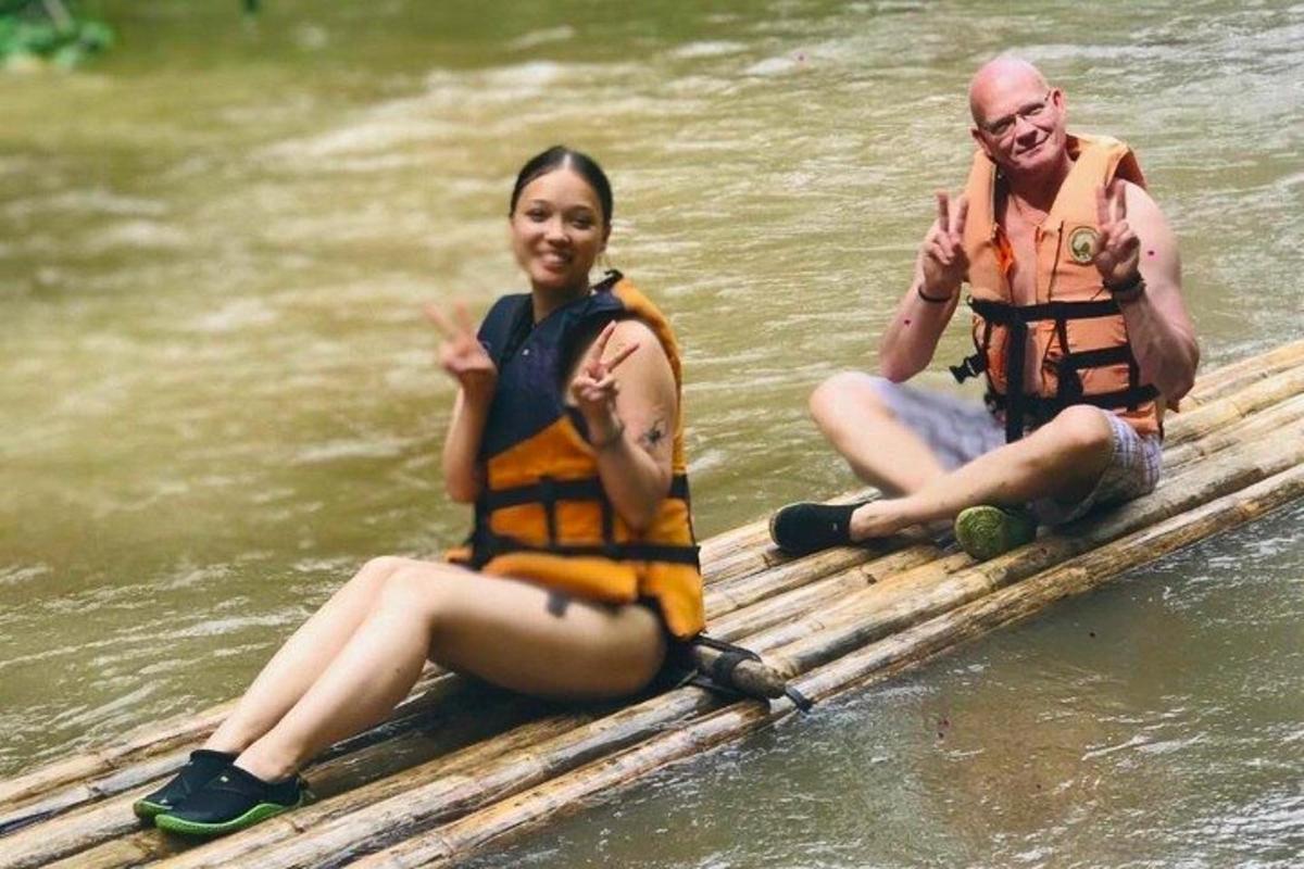two people sitting on a raft in the water