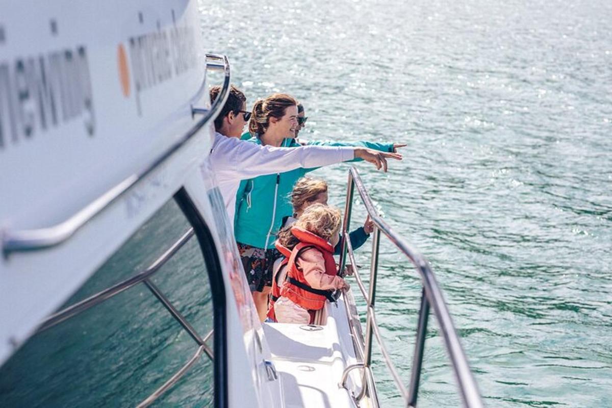 a group of people on a boat in the water
