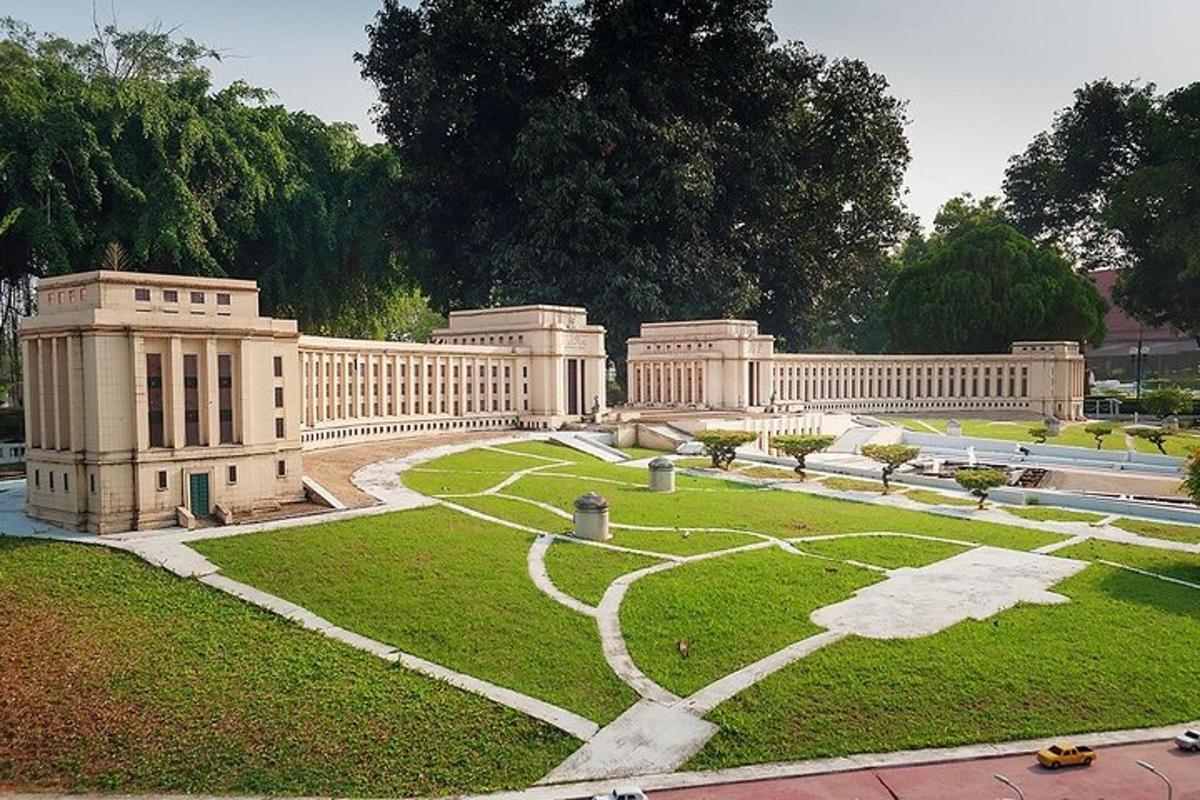 a large building with a garden in front of it