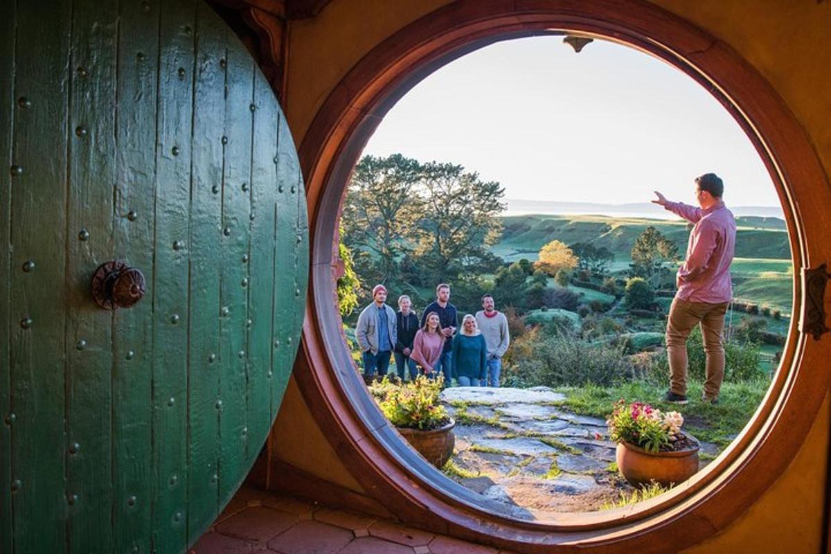 a group of people standing in a round window