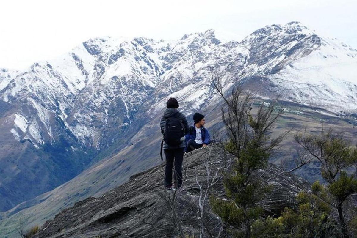 a man standing on top of a mountain