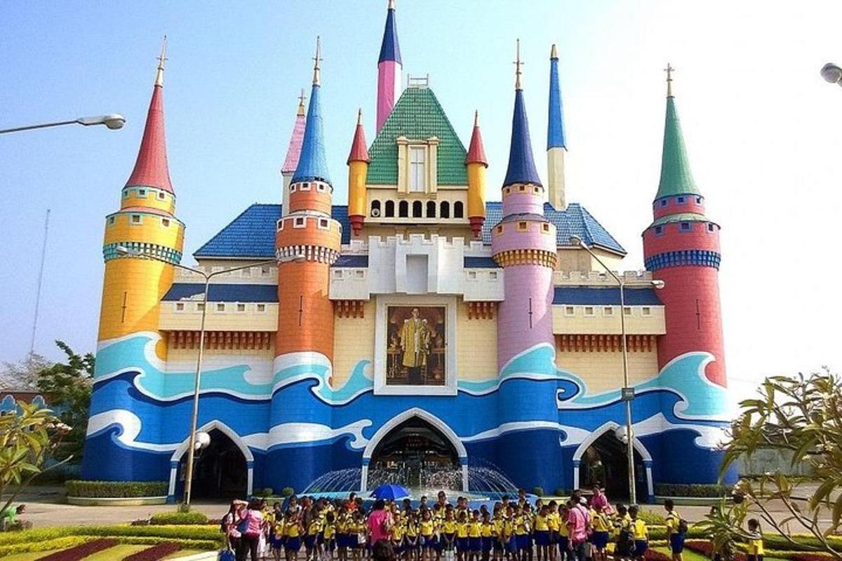 a group of people standing in front of a castle