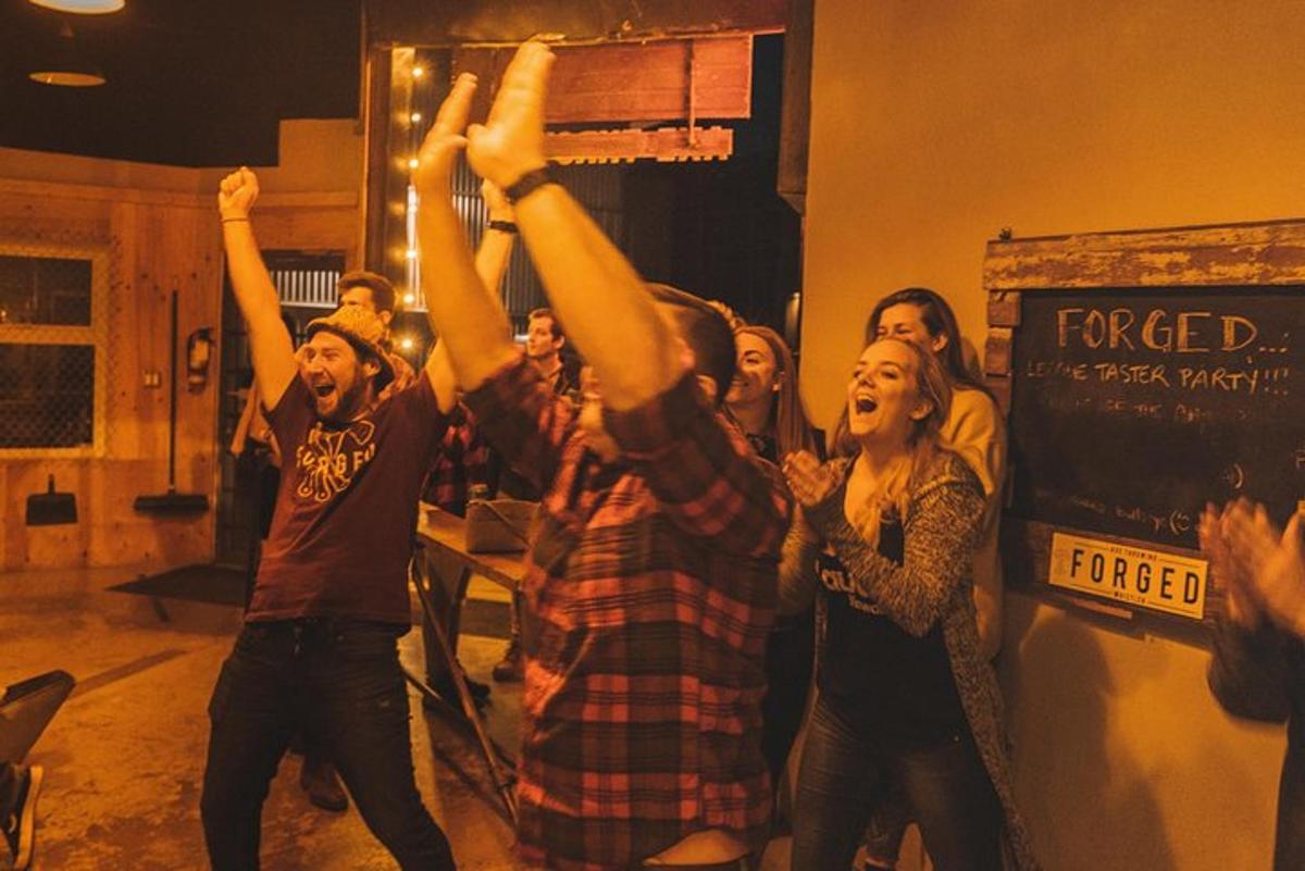 a group of people raising their hands in the air