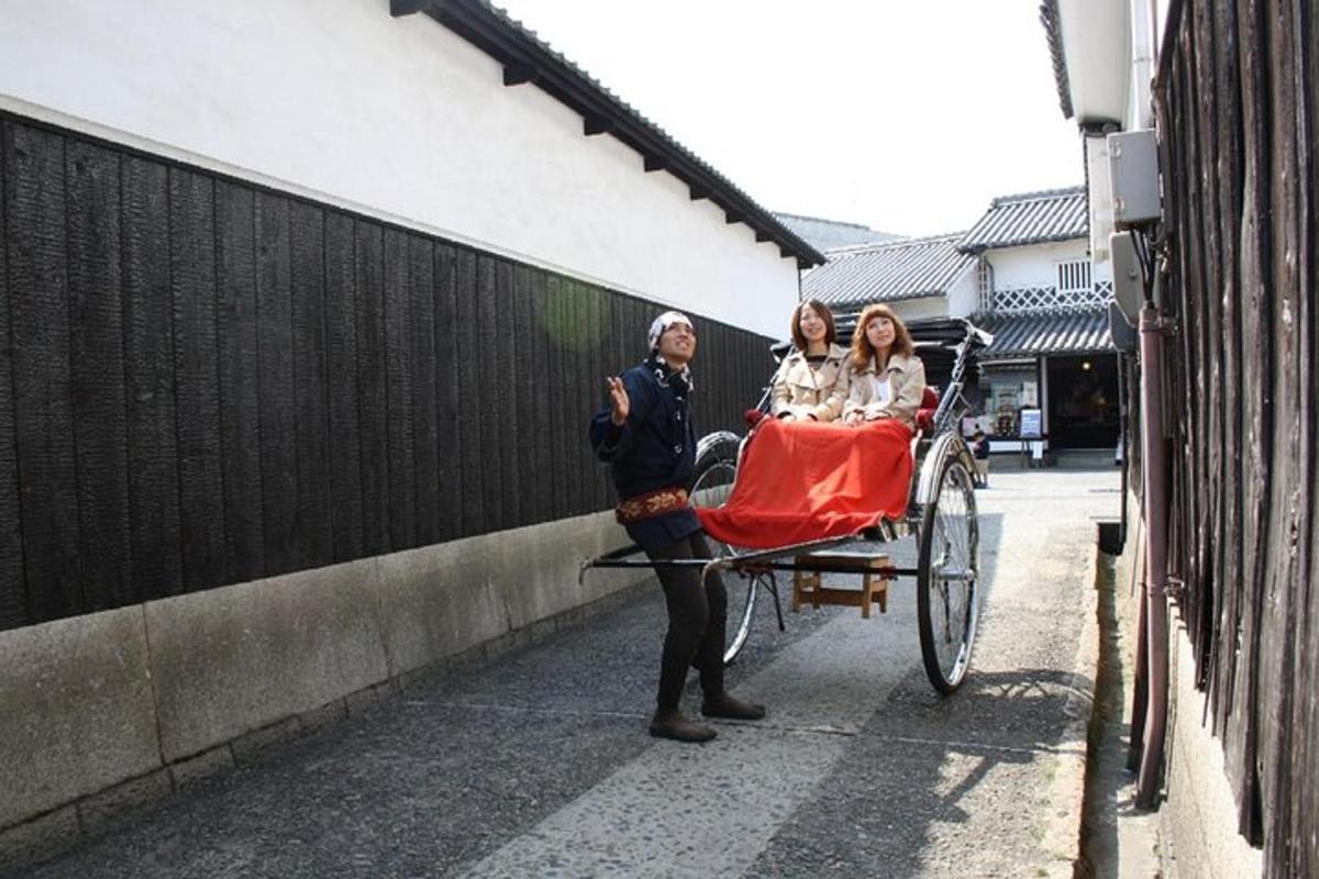 a man pulling a rickshaw with a woman in a carriage