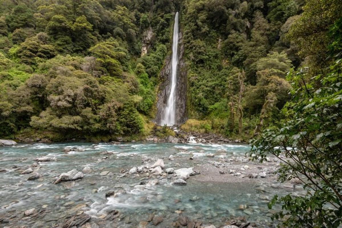 a waterfall in the middle of a river