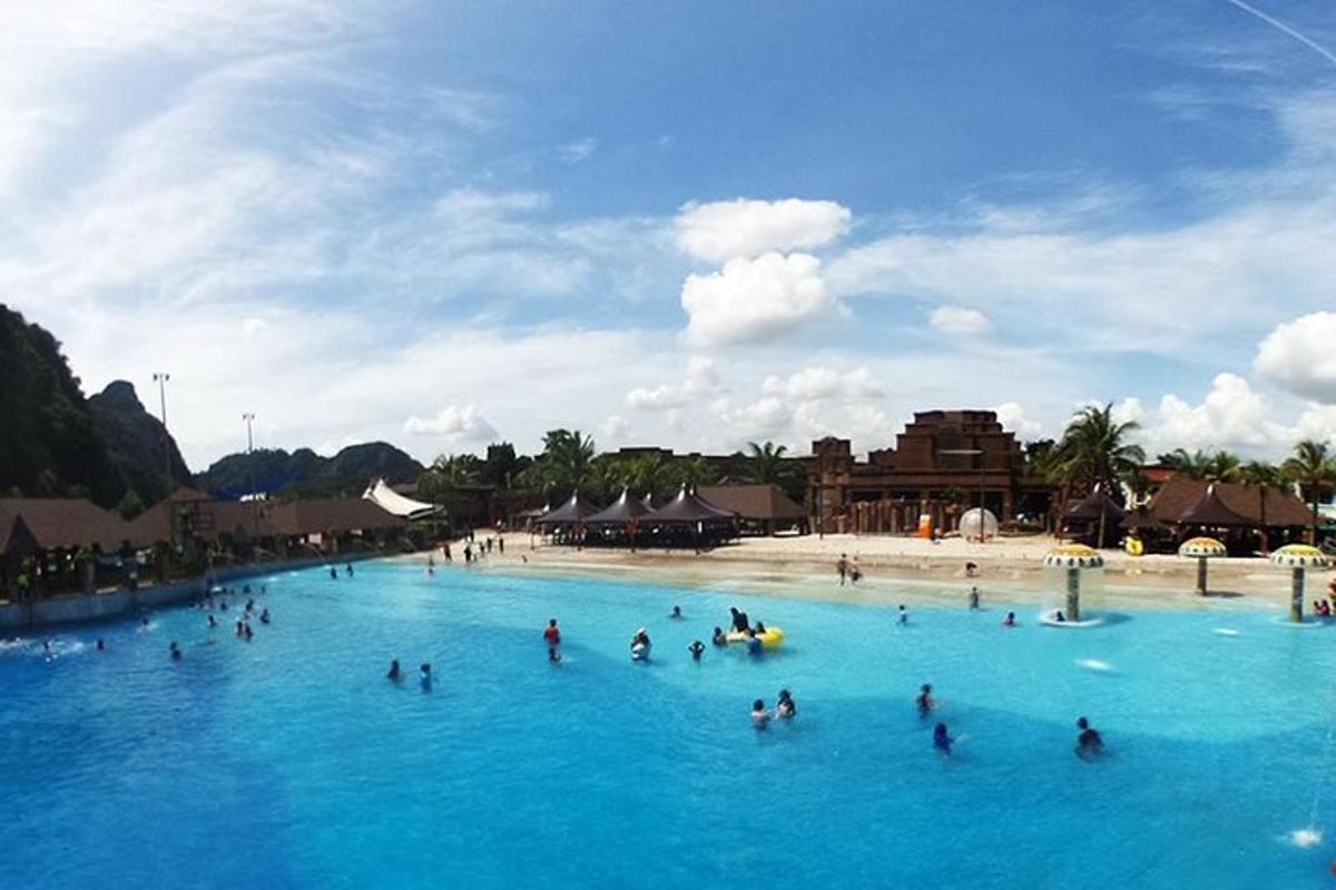 a group of people in the blue water at a resort