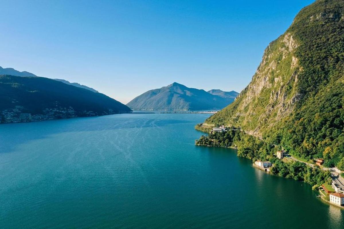 an aerial view of a lake between two mountains