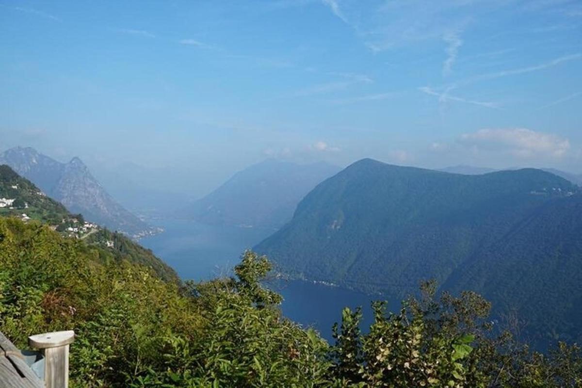 a view of a mountain valley with a lake