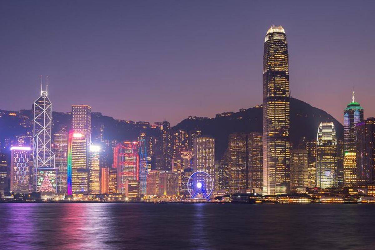 a city skyline at night with a large city