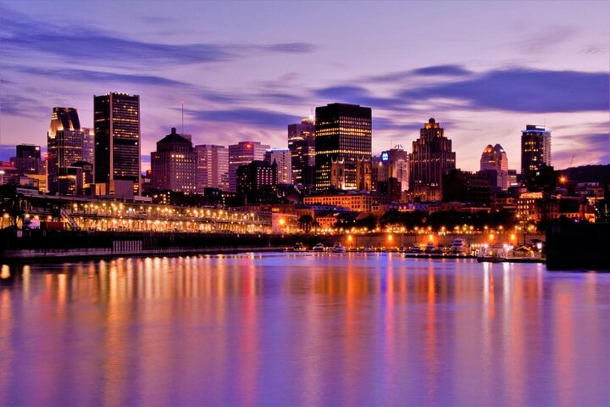 a view of a city at night with a river