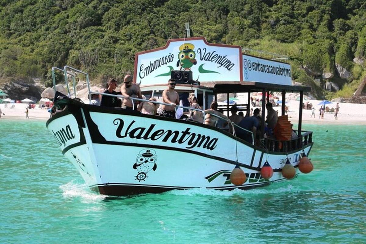 a boat with people on it in the water