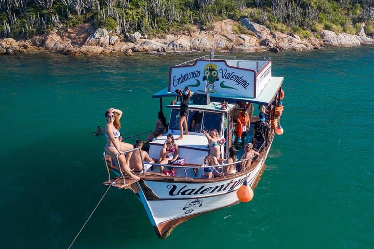 a group of people on a boat in the water