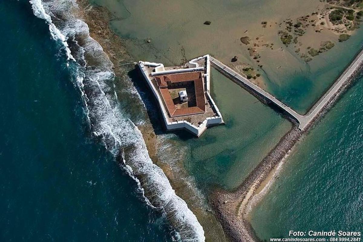 an aerial view of a house on the beach